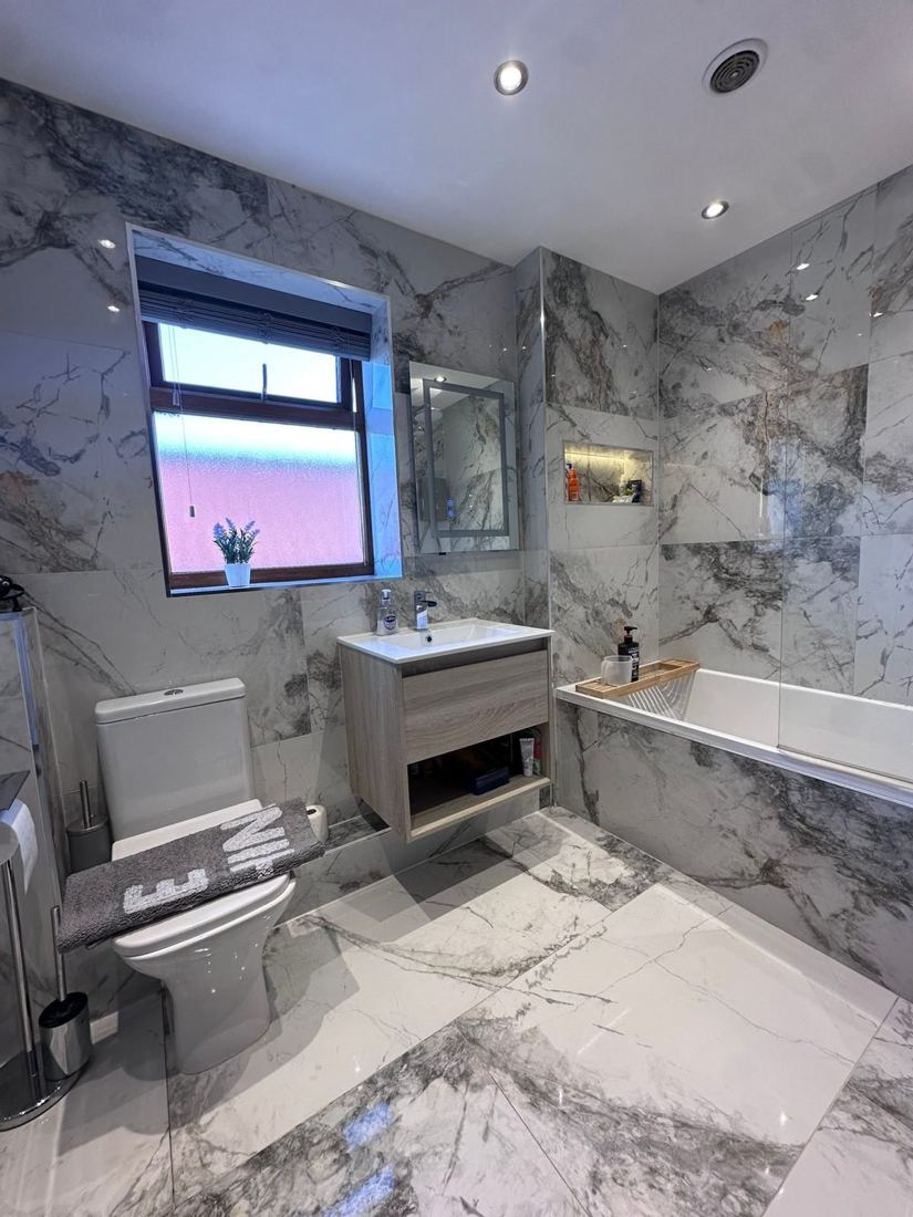 A sparkling marble bathroom after a Tidy Touch clean